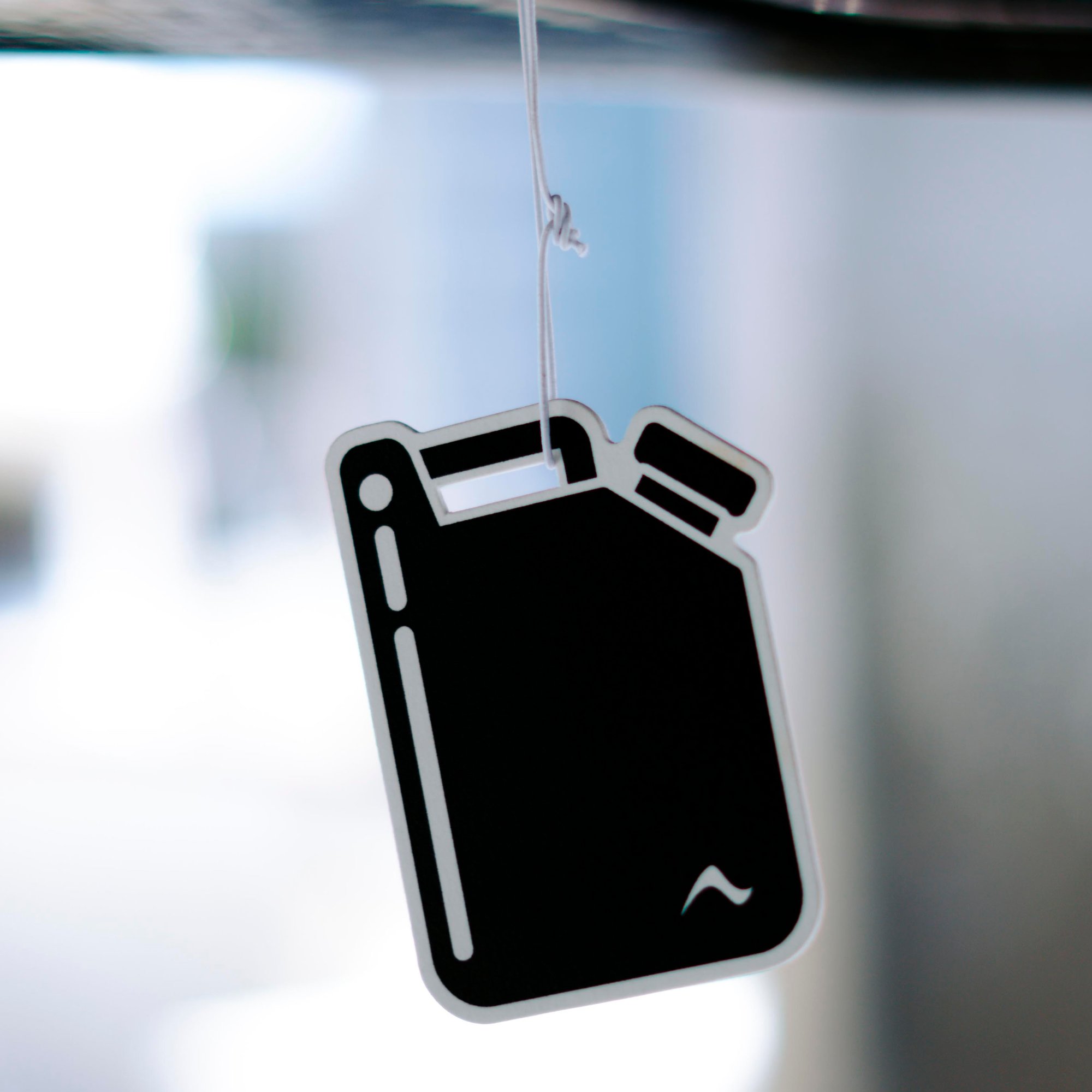 A gasoline can shaped air-freshener dangling from the Arc Sport's windshield 